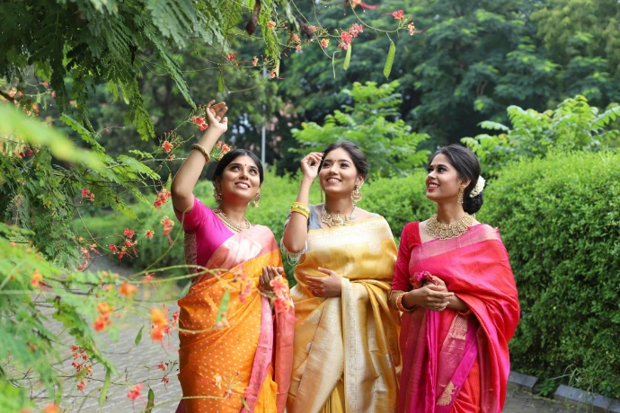 A group of three women standing next to each other